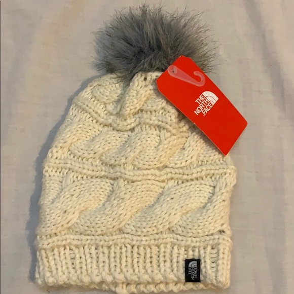 The North Face Accessories - North face cream knit beanie with fur Pom.